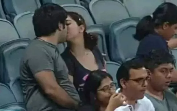 IPL couple kiss